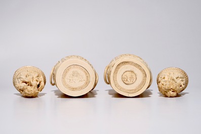 A pair of tall Chinese ivory vases and covers on wooden base, early 20th C.